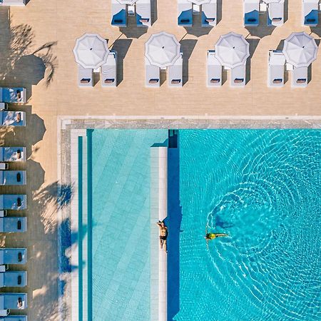 Ivi Mare - Designed For Adults By Louis Hotels Geroskipou Esterno foto Aerial view of the pool at the Hotel du Cap-Eden-Roc, Cap d'Antibes, France