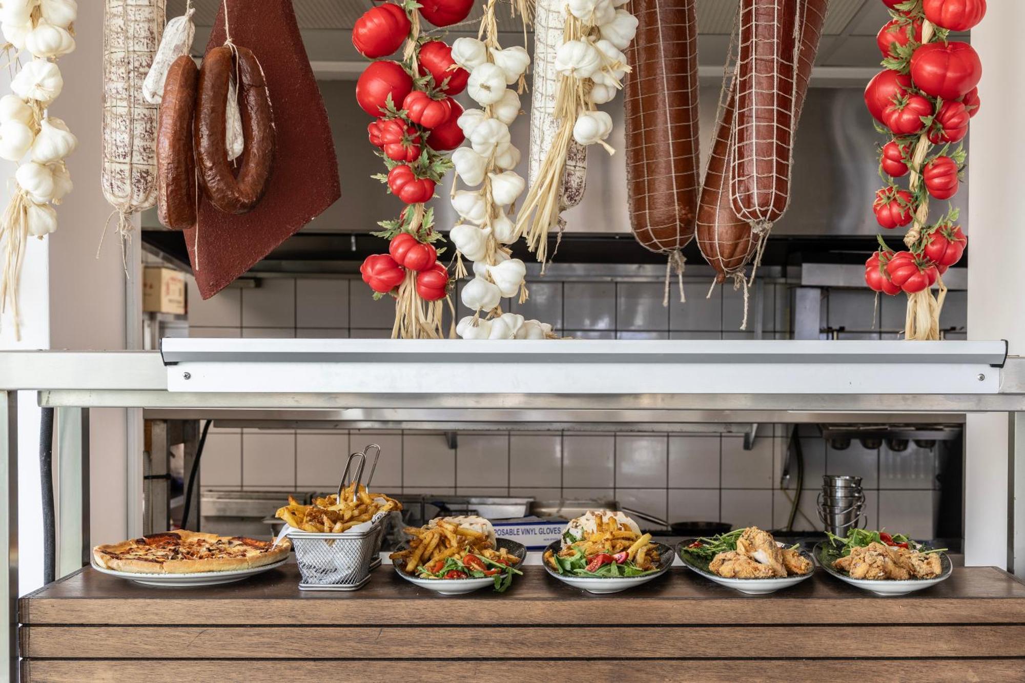 Ivi Mare - Designed For Adults By Louis Hotels Geroskipou Esterno foto A display of prepared tapas at a restaurant in Madrid